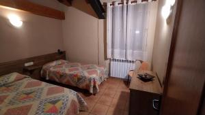Postel nebo postele na pokoji v ubytování Apartaments Beta