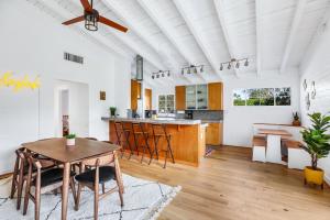 a kitchen and dining room with a table and chairs at The Kasbah in Palm Springs