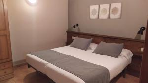 Postel nebo postele na pokoji v ubytování Apartaments Beta