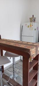 a table in a kitchen with a refrigerator at Anita in Villa Mercedes