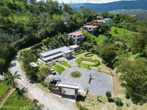 an aerial view of a house on a hill at Finca terraviva in Moniquirá