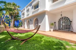 a hammock in front of a house at Haddad's for families in Tangier