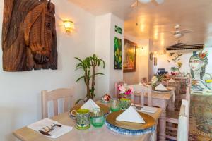 a dining room with a table and a dining room at Hotel Boutique Casa Isabel in Cartagena de Indias