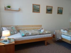 Postel nebo postele na pokoji v ubytování Apartments Ľubka