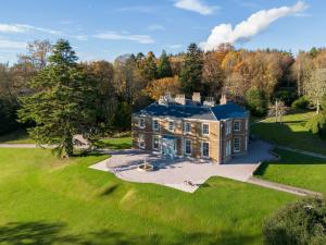 an aerial view of a large house on a lawn at Manar House Ground Floor Luxury Apartment in Inverurie