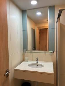 a bathroom with a sink and a mirror at Holiday Home - Santa Maria in Prainha