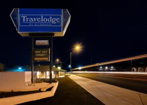 a sign for the travelodge of virginia at night at Travelodge by Wyndham Parker in Parker