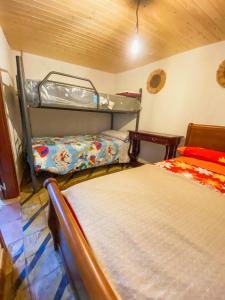a room with two bunk beds in a room at La Casita Encendida in Villamayor de Campos