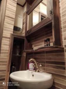 a bathroom with a sink and a mirror at NAOUSA 1 in Naousa Imathias