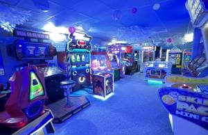 a room with many arcade games and video games at Westerley Cove in Lymington