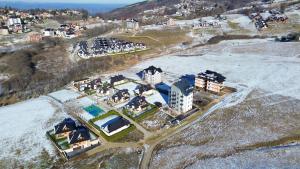 an aerial view of a city with buildings and snow at Vila Eden Lux in Zlatibor