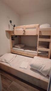 two bunk beds in a room with a ladder at Morféo-le Vignemale in Cauterets