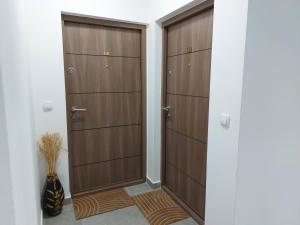 a hallway with two lockers and two closets at Vila Eden Lux in Zlatibor