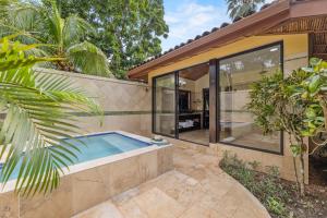 a swimming pool in the backyard of a house at Sleeping Giant Rainforest Lodge in Belmopan