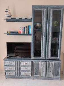 a gray cabinet with four drawers and a shelf at Vera Natura Apartamento Paula in Vera