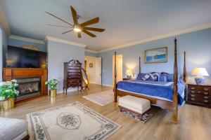 a bedroom with a bed and a ceiling fan at Immaculate Boone Villa with Entertainment Lounge! in Boone