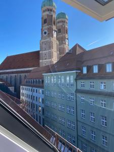 a view of a building with a clock tower at Suite One Löwengrube in Munich