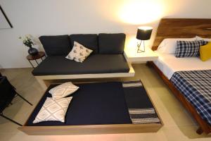 Ένα ή περισσότερα κρεβάτια σε δωμάτιο στο Spacious Studio, amazing rooftop with sea view +15 φωτογραφίες