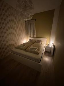 A bed or beds in a room at Travel Studio