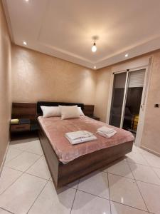 Giường trong phòng chung tại Appartement Cosy et Comfortable