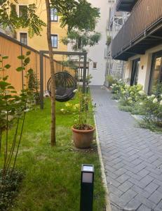 a cell phone sitting on the grass next to a garden at Suite One Einsteinstraße in Munich