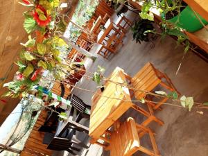 an overhead view of a table and chairs and flowers at Hostel paraiso de colores in Popayan