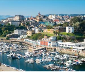 a group of boats docked in a harbor at Apartamento Obao in Ribadeo
