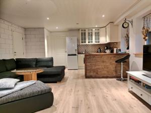 a living room with a couch and a kitchen at Meeresbrise in Reianes
