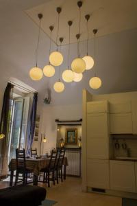 a dining room with a table and some lights at diLetto a Napoli in Naples