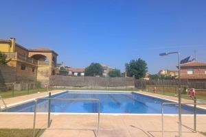 a large swimming pool in front of a building at Cozy house, Bespén, Huesca 