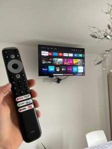 Et tv og/eller underholdning på Carlos Paz-Lake Towers + 41 billeder