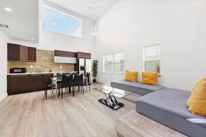 a living room with a bed and a kitchen at Ocean Drive Apartment Suites in Miami Beach in Miami Beach