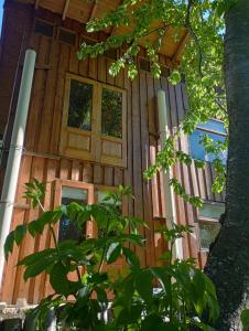 a log cabin with a door and windows at Casita en el bosque in San Carlos de Bariloche