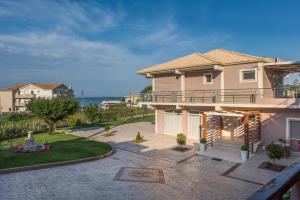 a view of a house with a balcony at Zoi Apartments in Tsilivi