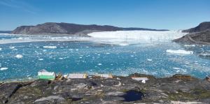 a group of icebergs in a body of water at Ilulissat Apartment in Ilulissat