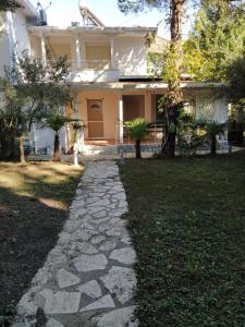 a walkway in front of a house at Vacation Home in Gjiri i Lalëzit, Lalëz, Durrës in Durrës