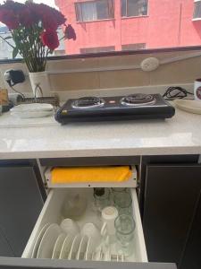 a kitchen drawer with a appliance on top of a counter at Suite Independiente e íntima al Norte de Quito in Quito