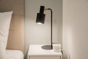 Katil atau katil-katil dalam bilik di Charming APT perfect for 4-6 tram, self-checkin