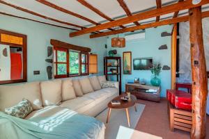 a living room with a couch and a table at Las Casas de la Rueda - La Casita in Santa Lucía