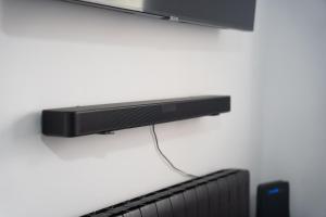 A television and/or entertainment centre at EDELWEISS HOUSE - Parking y Wifi GRATIS