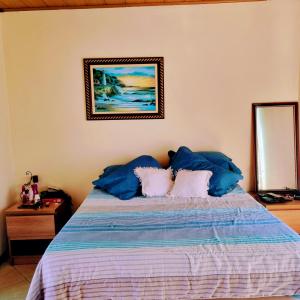 מיטה או מיטות בחדר ב-Casa Via Sol, Rio das Ostras