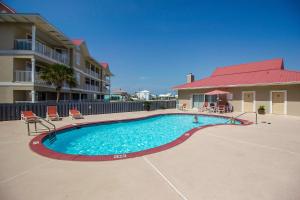 a swimming pool in front of a apartment building at Sunset Harbor Villas #4-421 in Navarre