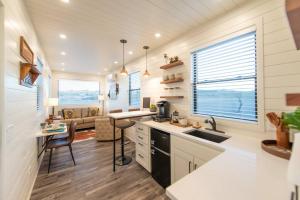 a kitchen with a sink and a counter top at New Southwest Shipping Container-In Alpine in Alpine