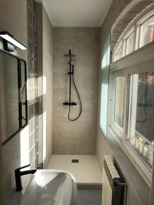a bathroom with a sink and a shower at Maison Biscuit. Apartament a la plaça de la vila in Camprodon +33 photos