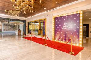 a red carpet in a lobby with a large screen at Planet Hollywood Costa Rica, An Autograph Collection All-Inclusive Resort in Culebra