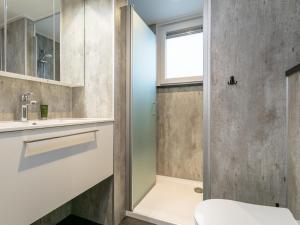 a bathroom with a shower and a toilet and a sink at Top-Nova Scotia in Voorthuizen +35 photos