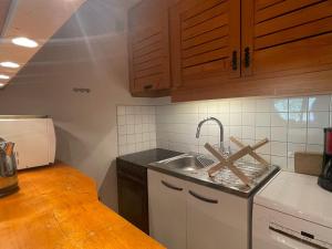 a kitchen with a sink and a counter top at Appartement Méribel, 2 pièces, 6 personnes - FR-1-411-863 in Les Allues