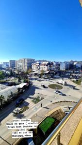 a view of a city with a street and buildings at Apartment 06 in Gjilan