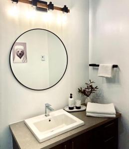 a bathroom with a sink and a mirror at The Golden View - Luxury Cottage in La Conception