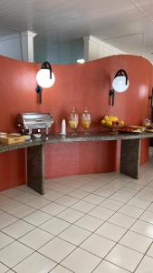 a kitchen with a counter with fruit on it at SÃO CRISTOVÃO HOTEL in São Luís